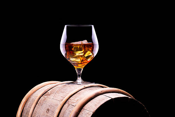istock Cognac or brandy on a wooden barrel 467129319