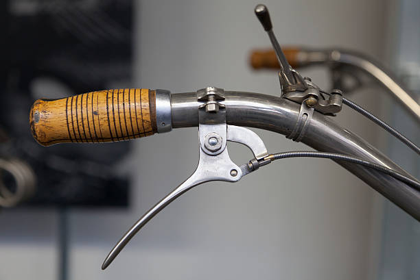 Antique wooden bicycle handle and break lever stock photo