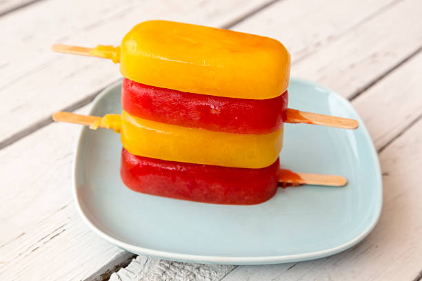 istock Blood orange and orange ice cream, popsicles on plate 467135112