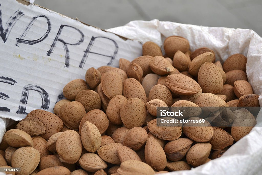 Almonds sack Almonds sack with street background Bag Stock Photo