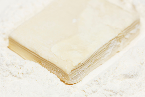Puff pastry in flour closeup