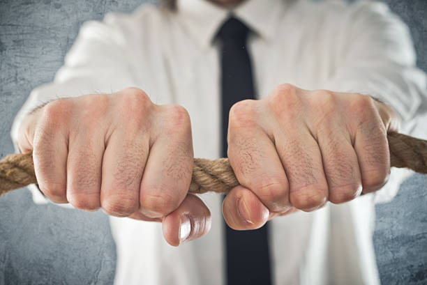 istock Businessman holding tight to a rope 467139517