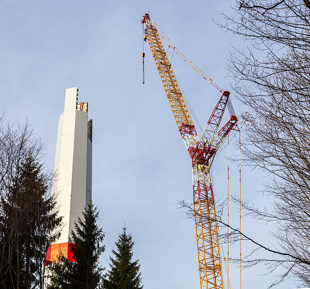 istock Wind turbine is built with a crane in wind farm 467139664