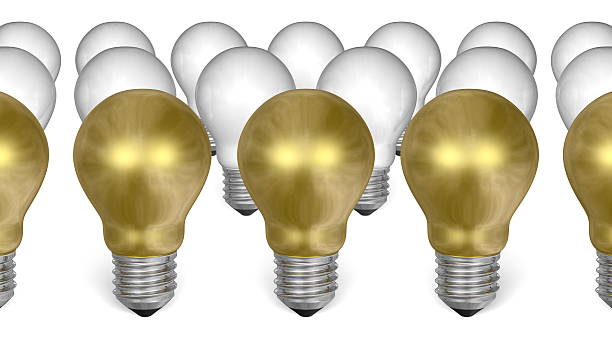istock Golden light bulbs in front of white ones 467142771