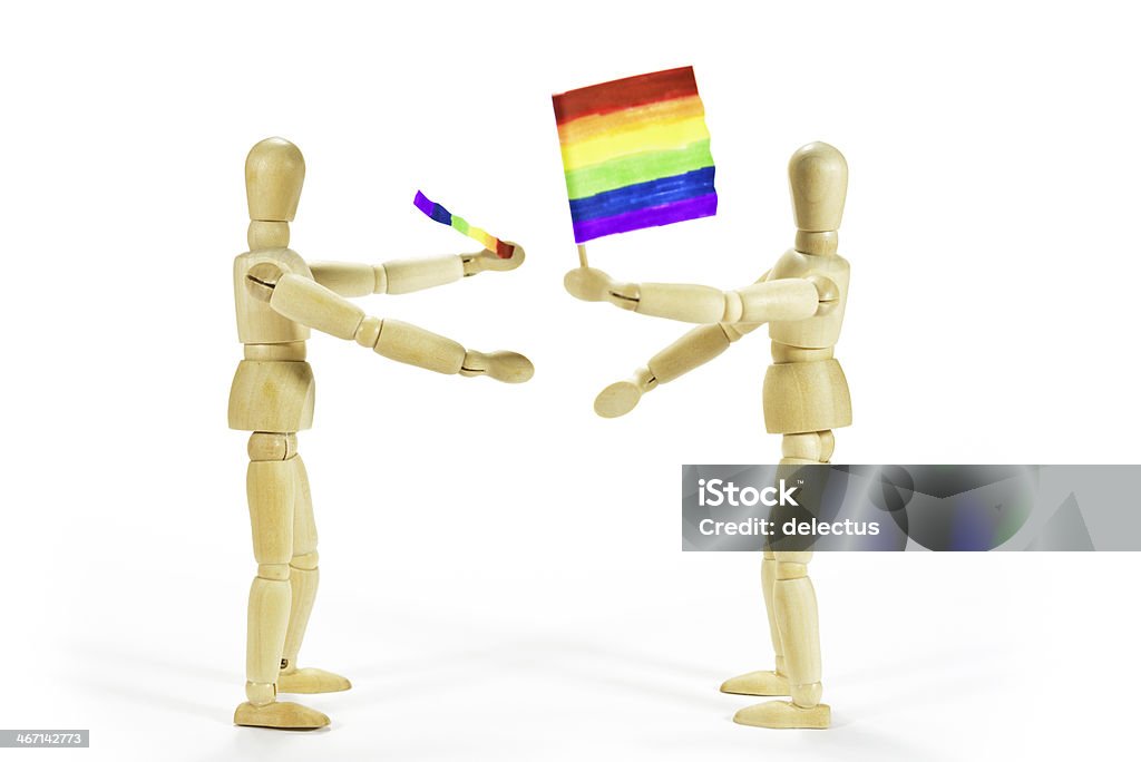 rainbow flag Wooden figures - symbolic representation of the struggle for recognition of schools and lesbians. Two homosexuals with self-painted rainbow flag. Admiration Stock Photo