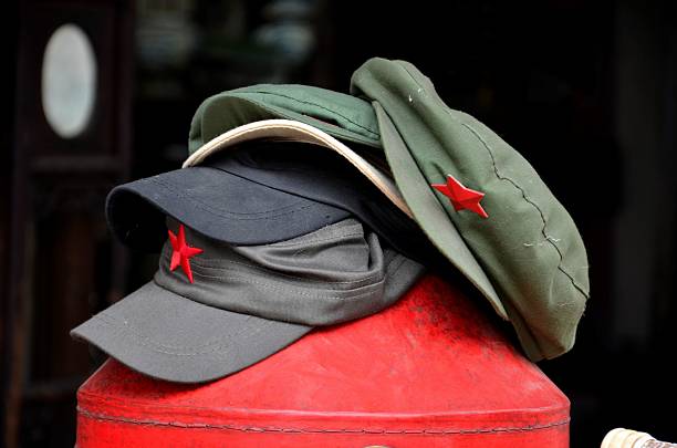 istock Stack of communist Maostyle caps with red star 467142838