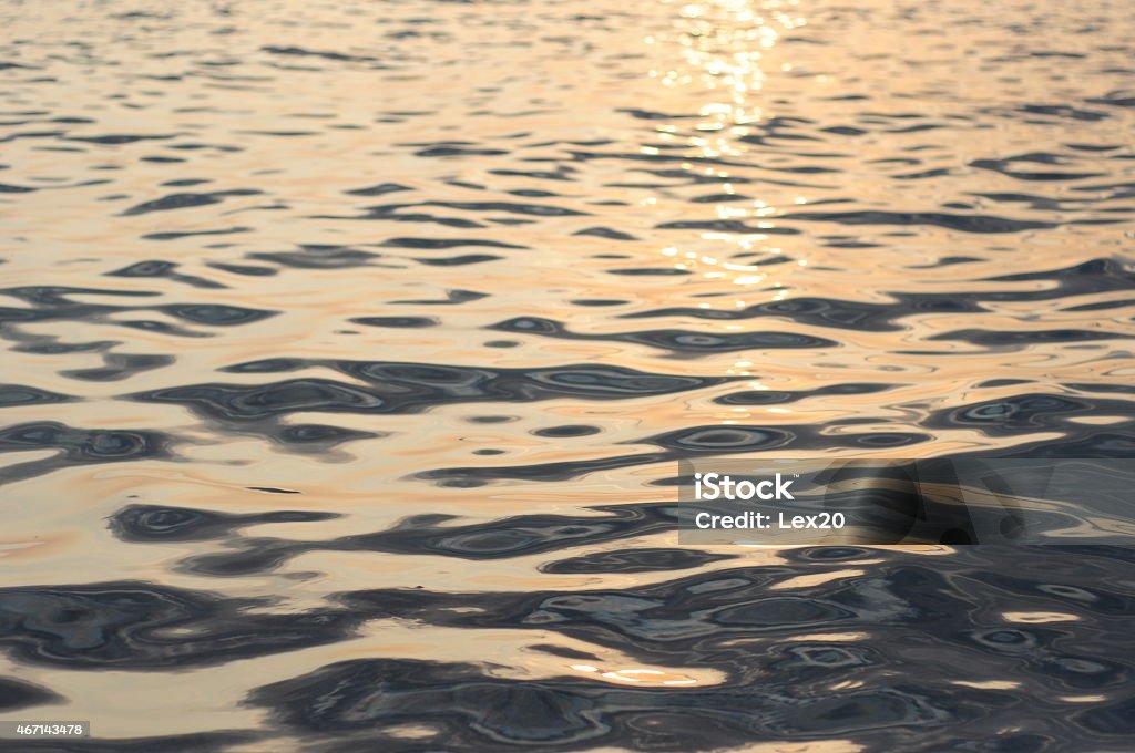 Mercury waves background with selective focus and sunlight Soft wave sea background with selective focus and sunlight. Mercury - Metal Stock Photo