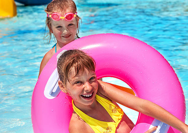 istock Children female  swimming in pool 467143732