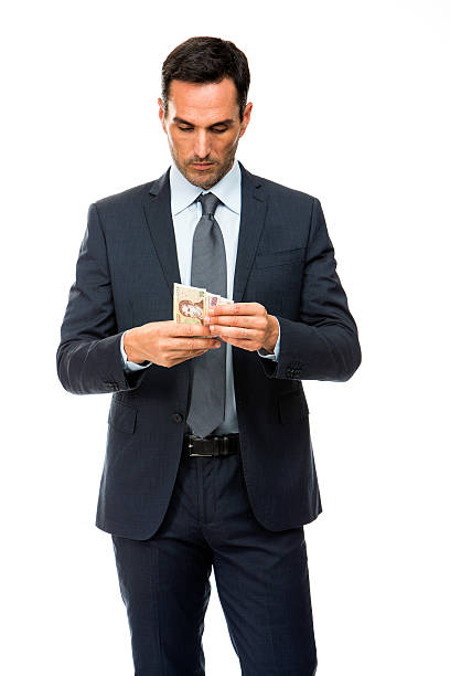 istock businessman counting money 467144276