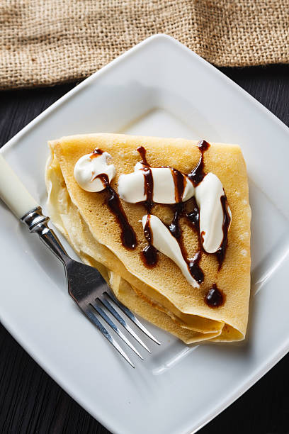 istock Sweet pancake with chocolate sauce and yogurt 467145421