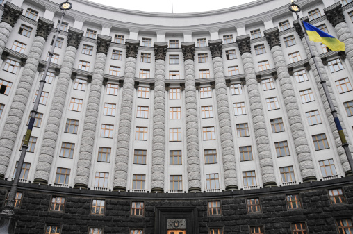 The Cabinet of Ministers of Ukraine, also known as the Government of Ukraine in Kiev with the national flag waving.