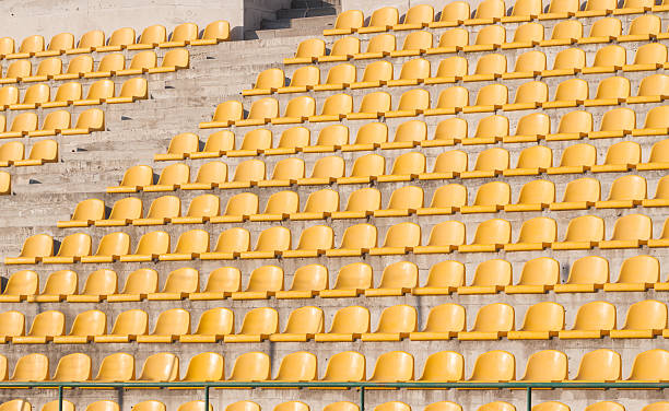 istock yellow chairs on the soccer field 467147756