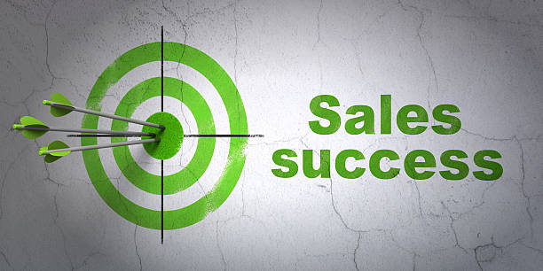 Marketing concept: target and Sales Success on wall background