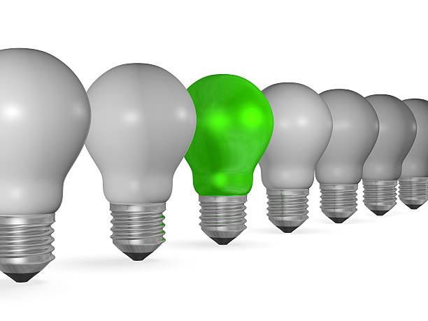 istock One green light bulb in row of many grey ones 467149177