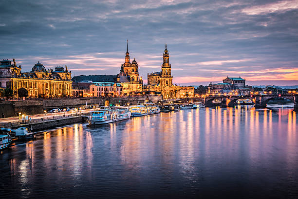 istock Dresden harbor at dusk with reflections of lights in water 467149505
