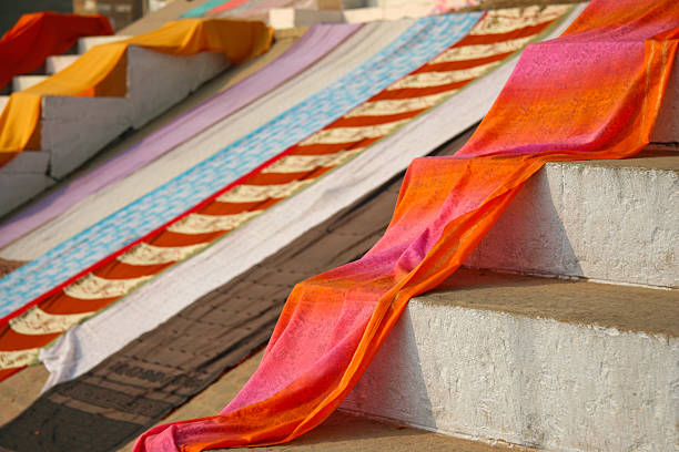 Traditional indian fabrics and colorful silk clothes exposed on a street at Varanasi