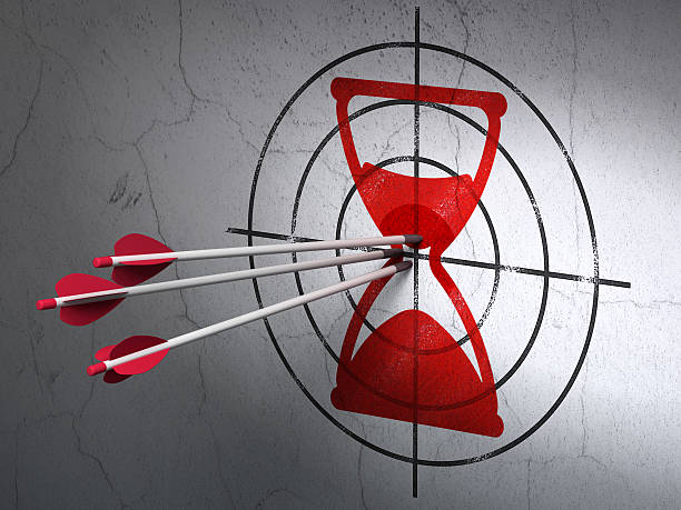 istock Time concept: arrows in Hourglass target on wall background 467150505