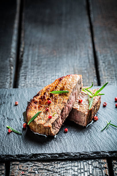 istock Hot roasted beef with fresh rosemary on plate 467151472