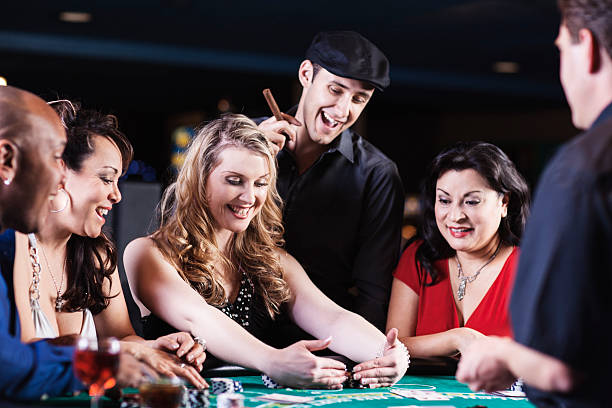 istock Happy winner among diverse people at the blackjack table 467152869