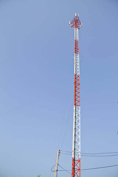 istock communications tower with antennas against blue sky 467153085