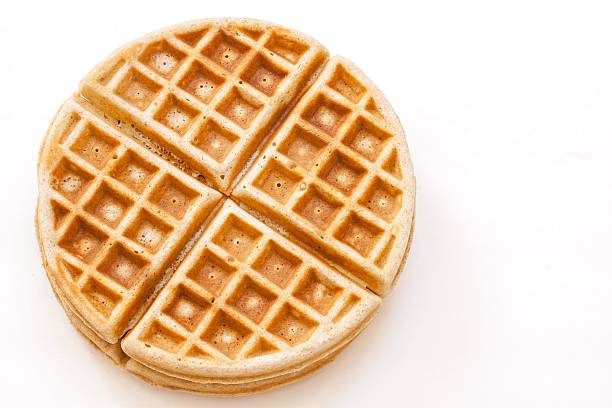 Waffle isolated on white Homemade whole wheat waffle isolated on white waffle stock pictures, royalty-free photos & images