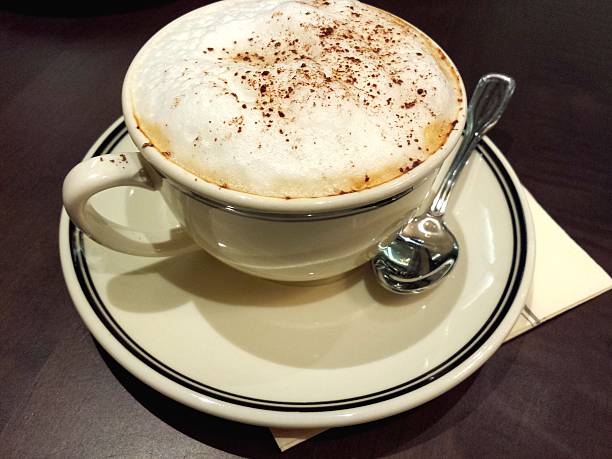 istock Cappuccino Coffee isolated on dark background 467159292