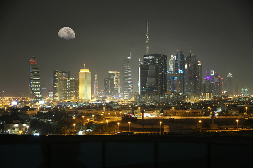 Night view with moon of Dubai, United Arab Emirates