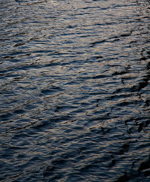 water wave dark grey surface background stock photo