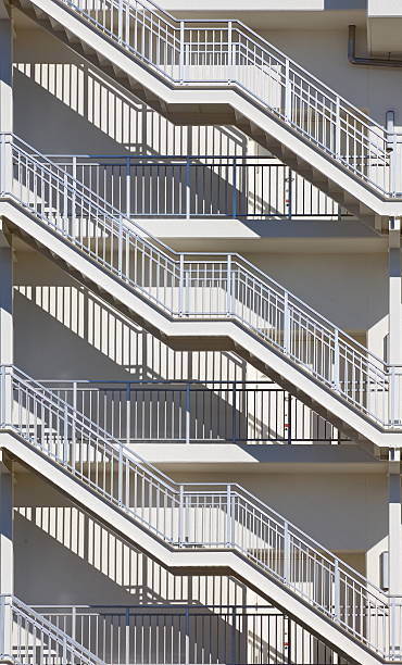 istock Metal fire escape outside apartment building for emergency 467170782
