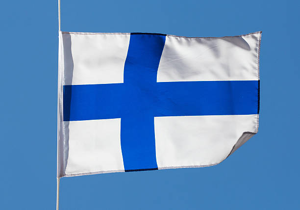 istock Finnish flag in the wind against a sky 467177769
