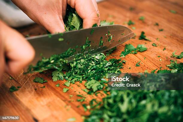 Cutting Parsley In A Kitchen Stock Photo - Download Image Now - Chef, Table Knife, Parsley