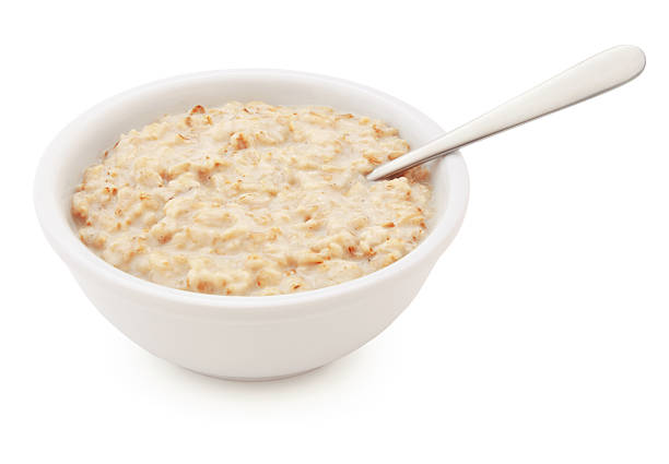 tazón de avena y cuchara (con ruta) - oatmeal fotografías e imágenes de stock