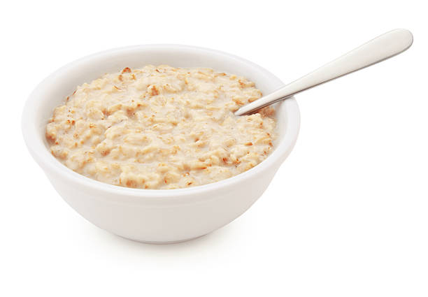 Oatmeal Bowl and spoon Oatmeal Bowl and spoon isolated on white (excluding the shadow) porridge stock pictures, royalty-free photos & images