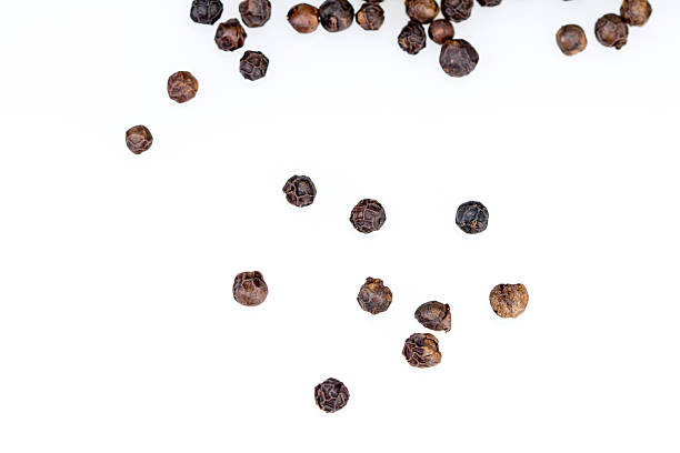 istock closeup dried black pepper on white background 467180584