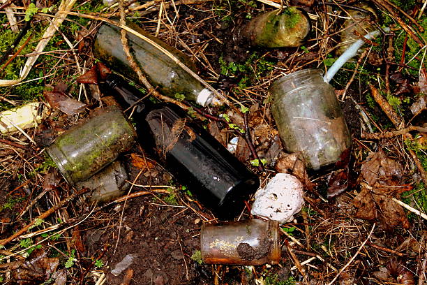 istock Glass jars and bottles and dolls head at old tip 467181256