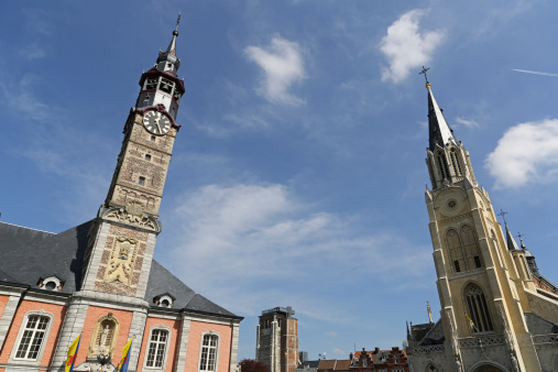 The rebuilt medieval Belfry of Bergues, in Bergues, Hauts-de-France. Destroyed in the Second world War, the 47m high tower is now UNESCO listed. Copy space to left.