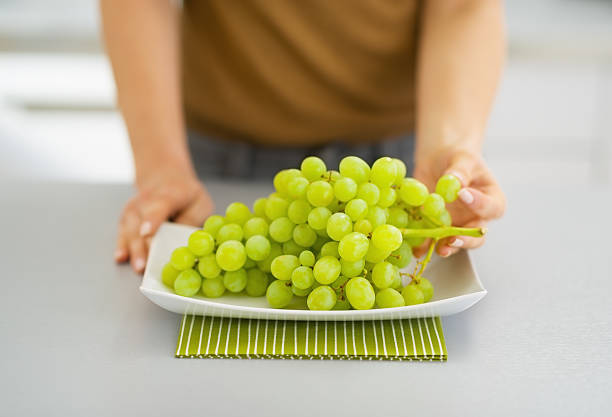 istock Branch of grapes on plate. Closeup 467188131