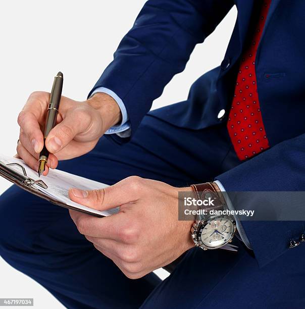 Businessman Writes The Document Stock Photo - Download Image Now - 2015, Adult, Agreement