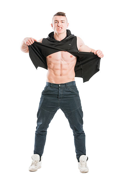 Full body of a young muscular and angry male model stock photo