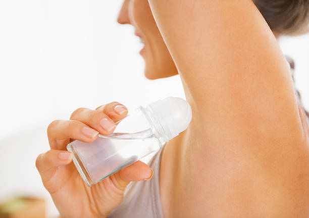 istock Young woman applying deodorant on underarm. Closeup 467198579