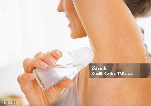 Young Woman Applying Deodorant On Underarm Closeup Stock Photo - Download Image Now