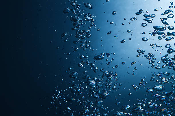 istock air bubbles in water blue natural background 467198755