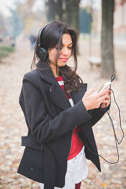 istock young beautiful indian woman at the park 467201018