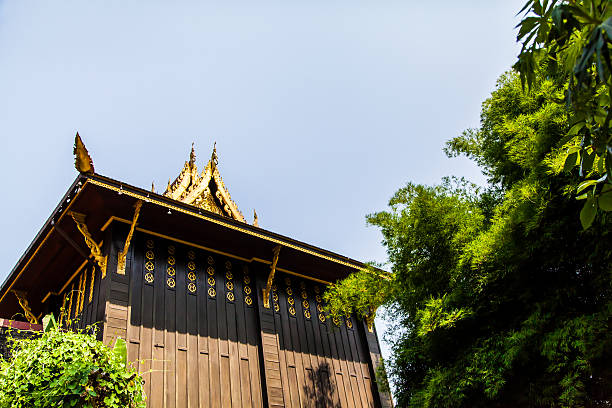 Chiang Rai, Thailand - May 2, 2013: Buddhist temple of black color wall named Wat phra kaeo in Chiang Rai, Thailand.
