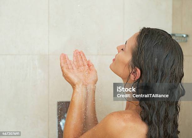 Young Woman Washing In Shower Rear View Stock Photo - Download Image Now - Adult, Back, Bathroom