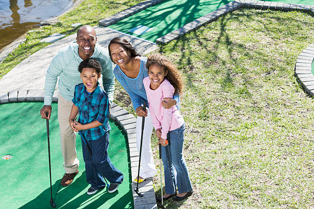 istock Family playing miniature golf 467207922