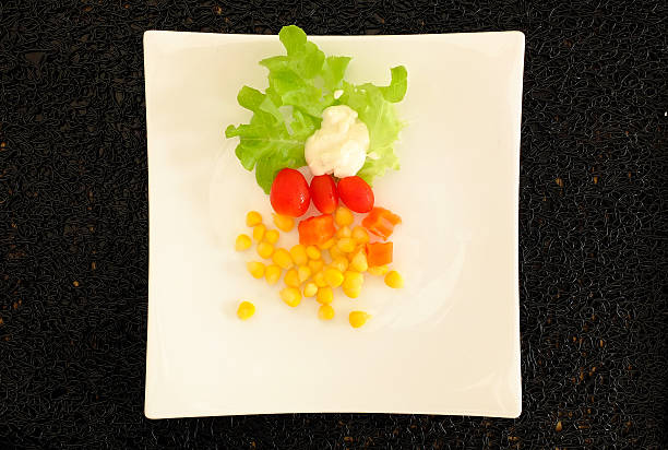 istock Healthy mixed greek salad served on a white plat 467208216