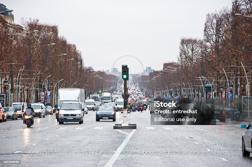 The Avenue des Champs-Élysées in Paris, France. Paris, France - January 10, 2013: The Avenue des Champs-Élysées,  traffic on the street. 2015 Stock Photo