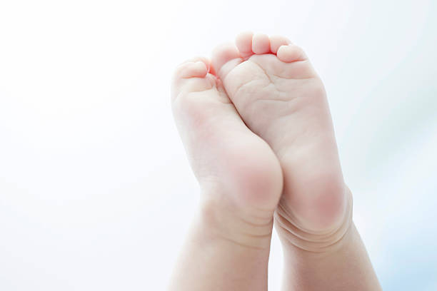 istock newborn baby feet isolated 467208991