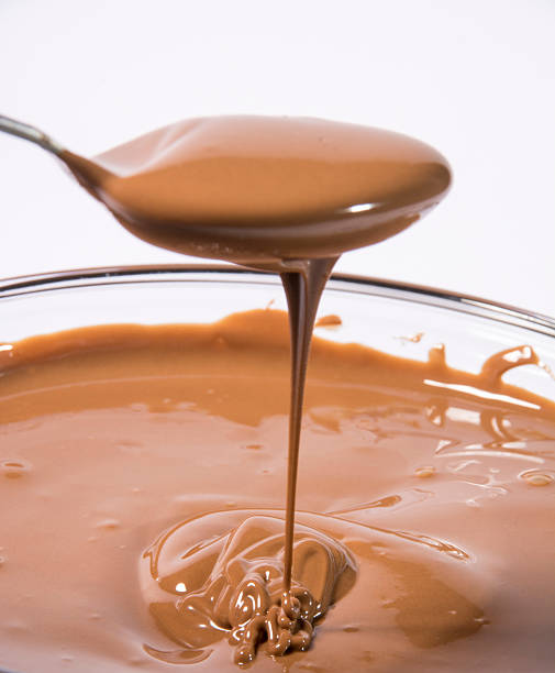 istock Glass bowl of melted milk chocolate 467209089